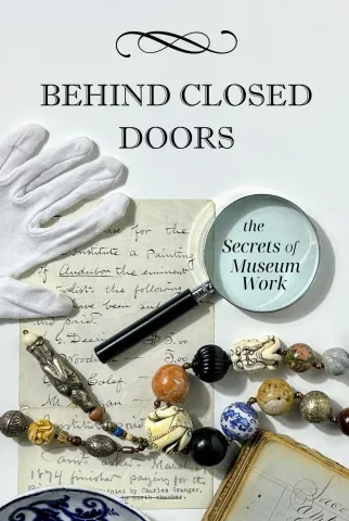 picture of magnifying glass, white glove, parchment and antique necklace